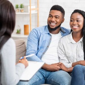 Happy Black Couple with therapist Happy Black Couple with therapist